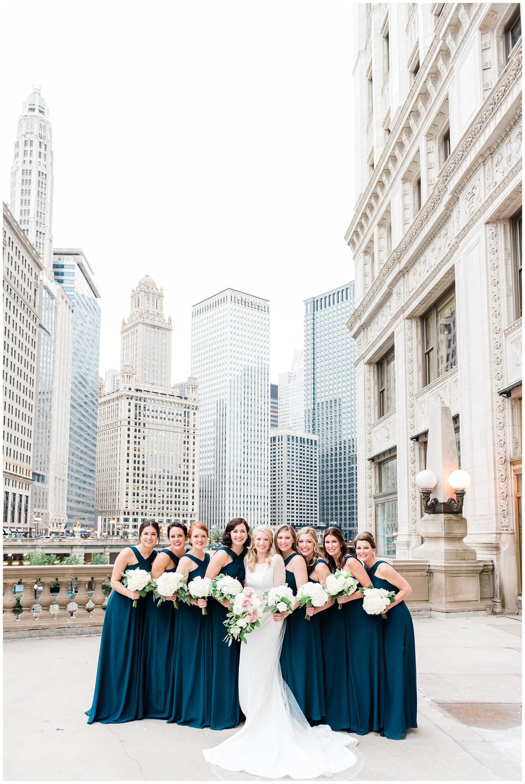 bride and bridesmaids bouquets at michigan street bridge in chicago