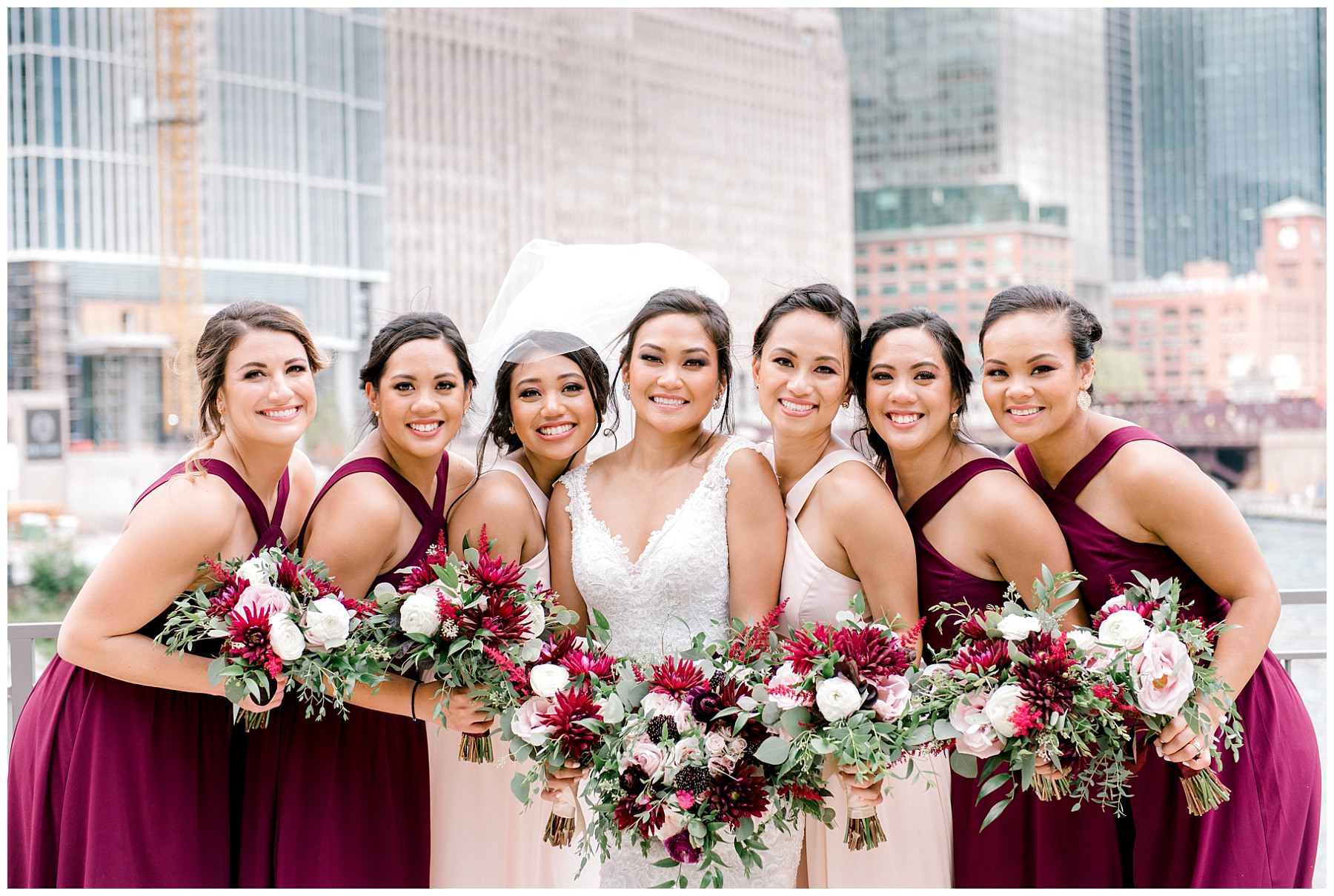 bride and bridesmaids with their bouquets atchicago river walk