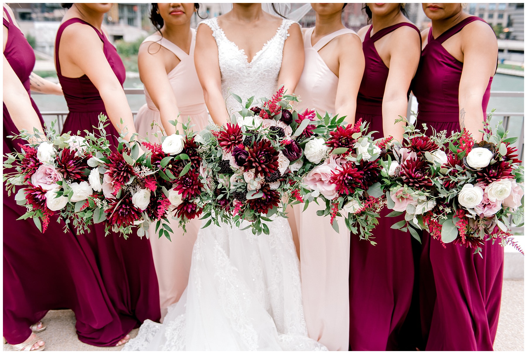 bride and bridesmaids bouquets in front of merchandise mart plaza