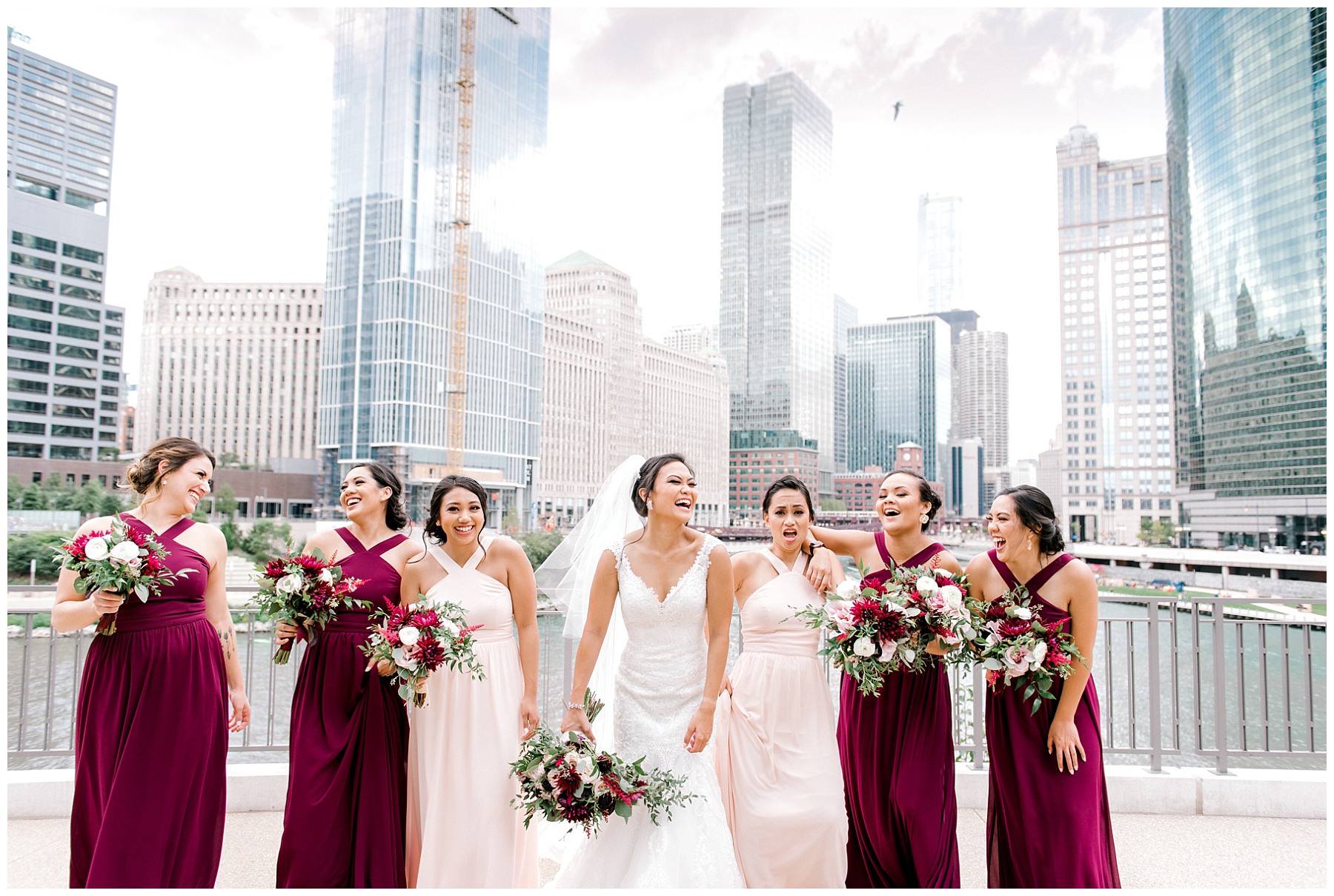 bride walking and laughing with her bridesmaids at chicago river walk