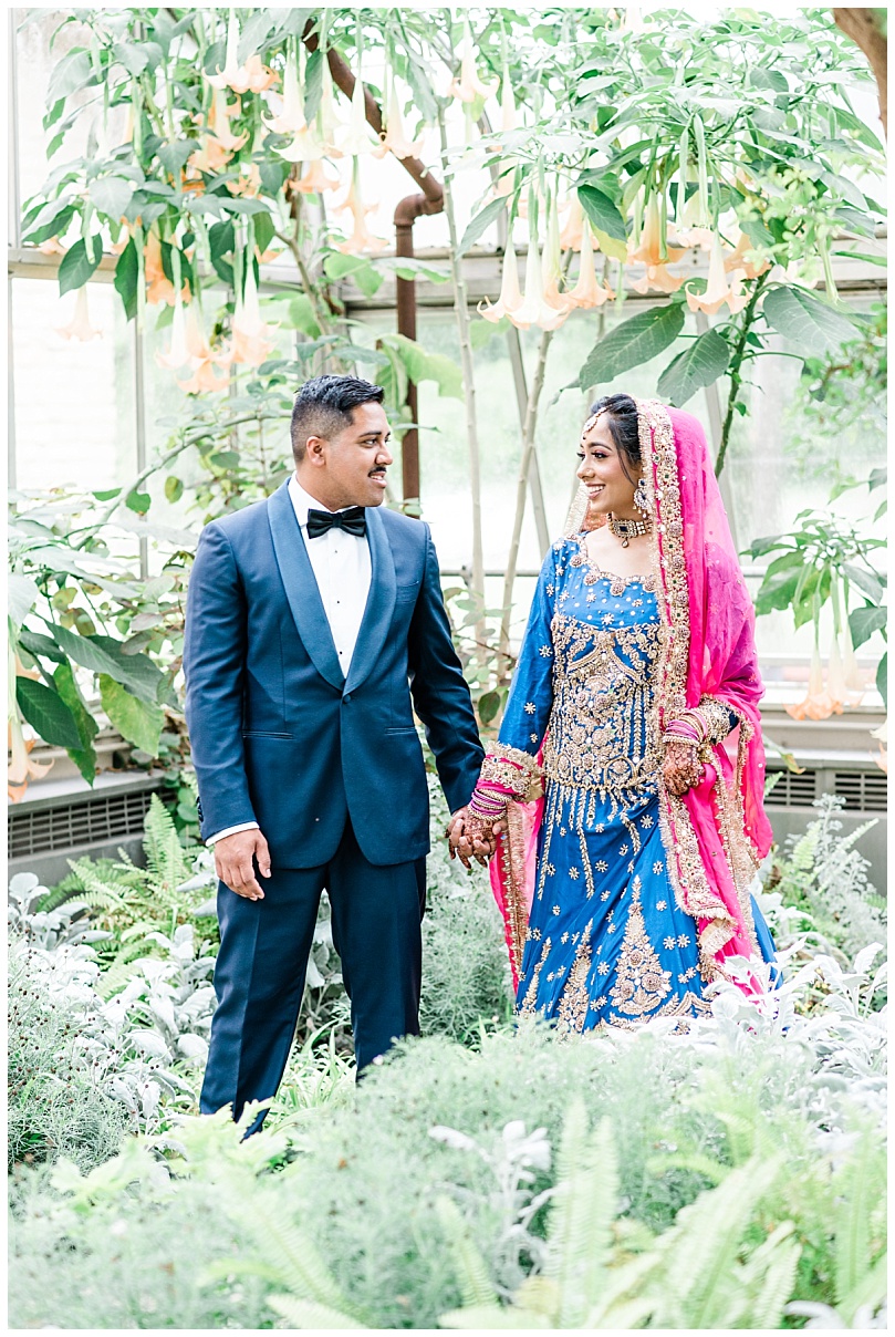 south asian bride and groom at bird haven conservatory greenhouse in joliet